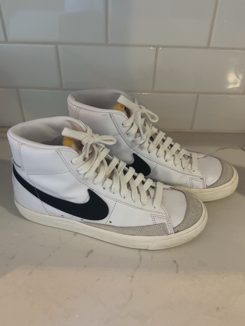 Nike Women’s White High-Top Sneakers with Black Swoosh and Gray Suede Toe